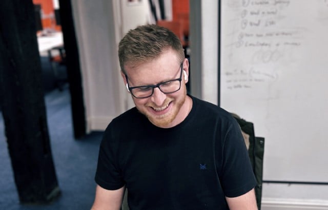 CTO Gareth Drew smiling with airpods in his ears