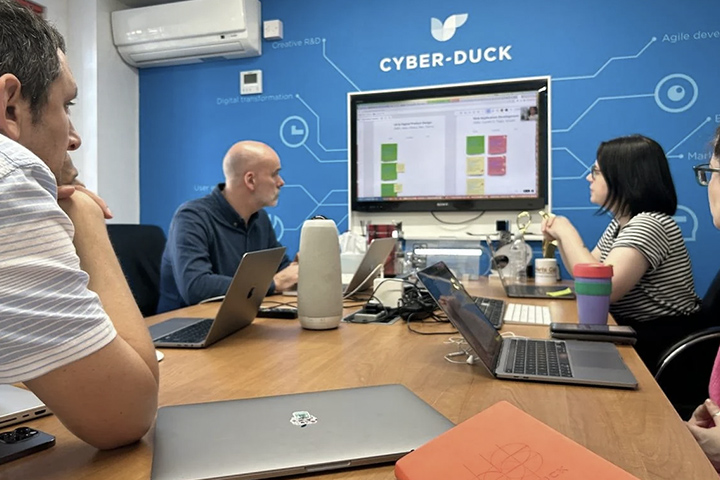 Cyber-Duck content team conducting a workshop in an office