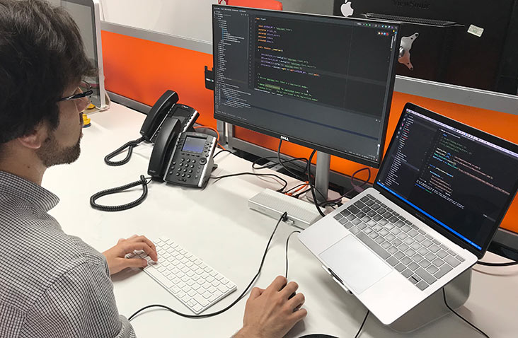 Developer working on PHP code at his desk