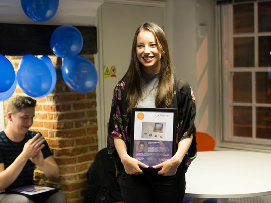 Sinead holding her Duckies 2014 Winners certificate
