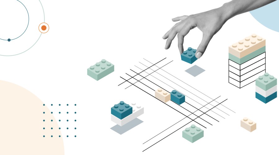 Hand playing with lego bricks, representing a design system set-up