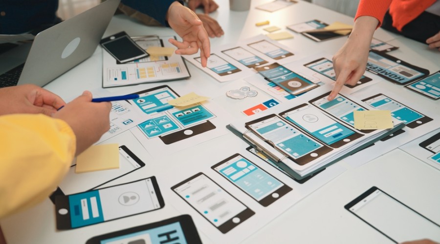Service Design workshop working on mobile screen user journey flows 