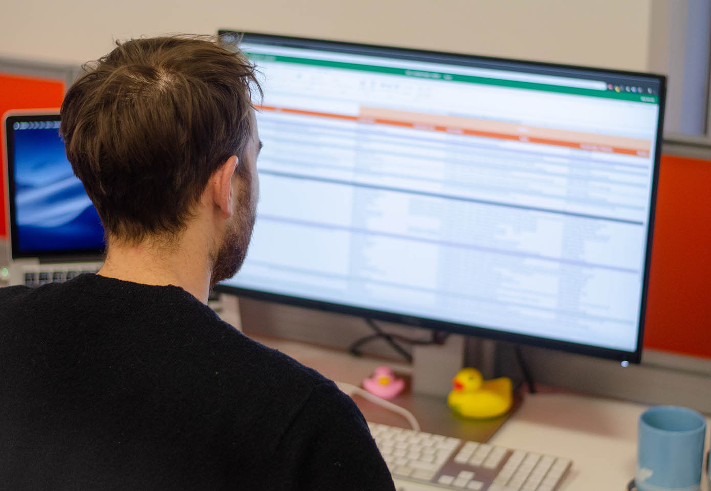 Ollie works on a content strategy spreadsheet