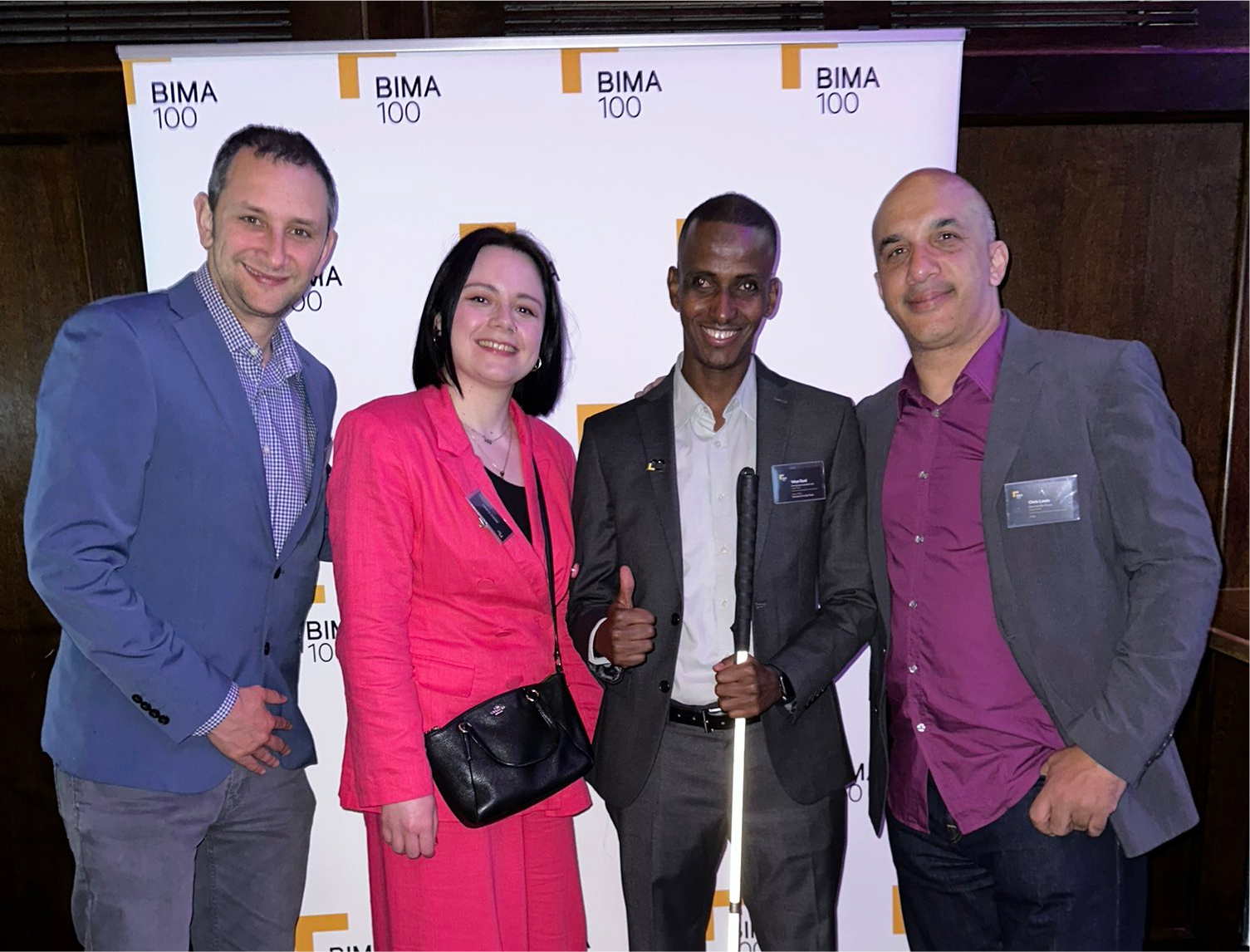 A picture of Yahye Siyad winning a BIMA 100 Award 2023 with CEO Danny Bluestone, Chris Lewis and Jessica Graham