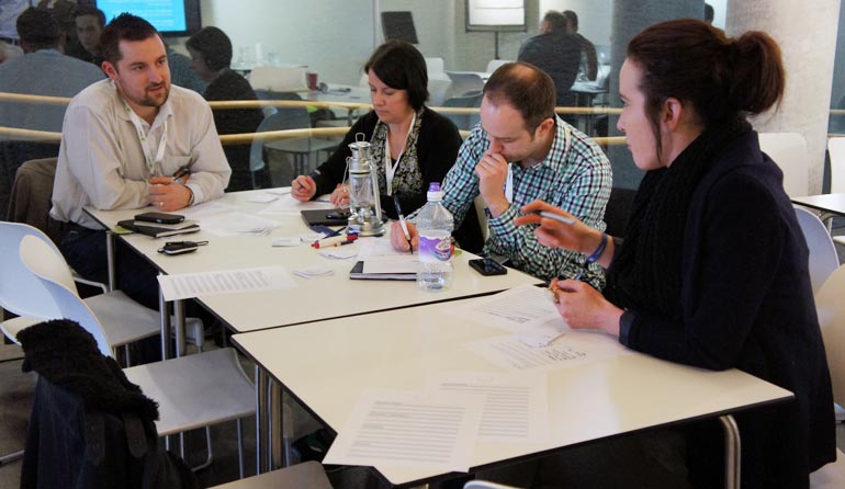 Some of our workshop attendees discussing user stories.