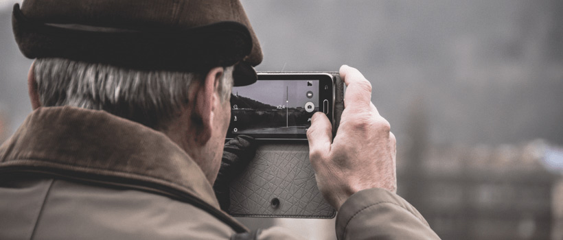 Elderly Man Using iPhone