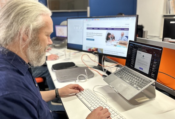 Photo of developer Gareth coding at his desk