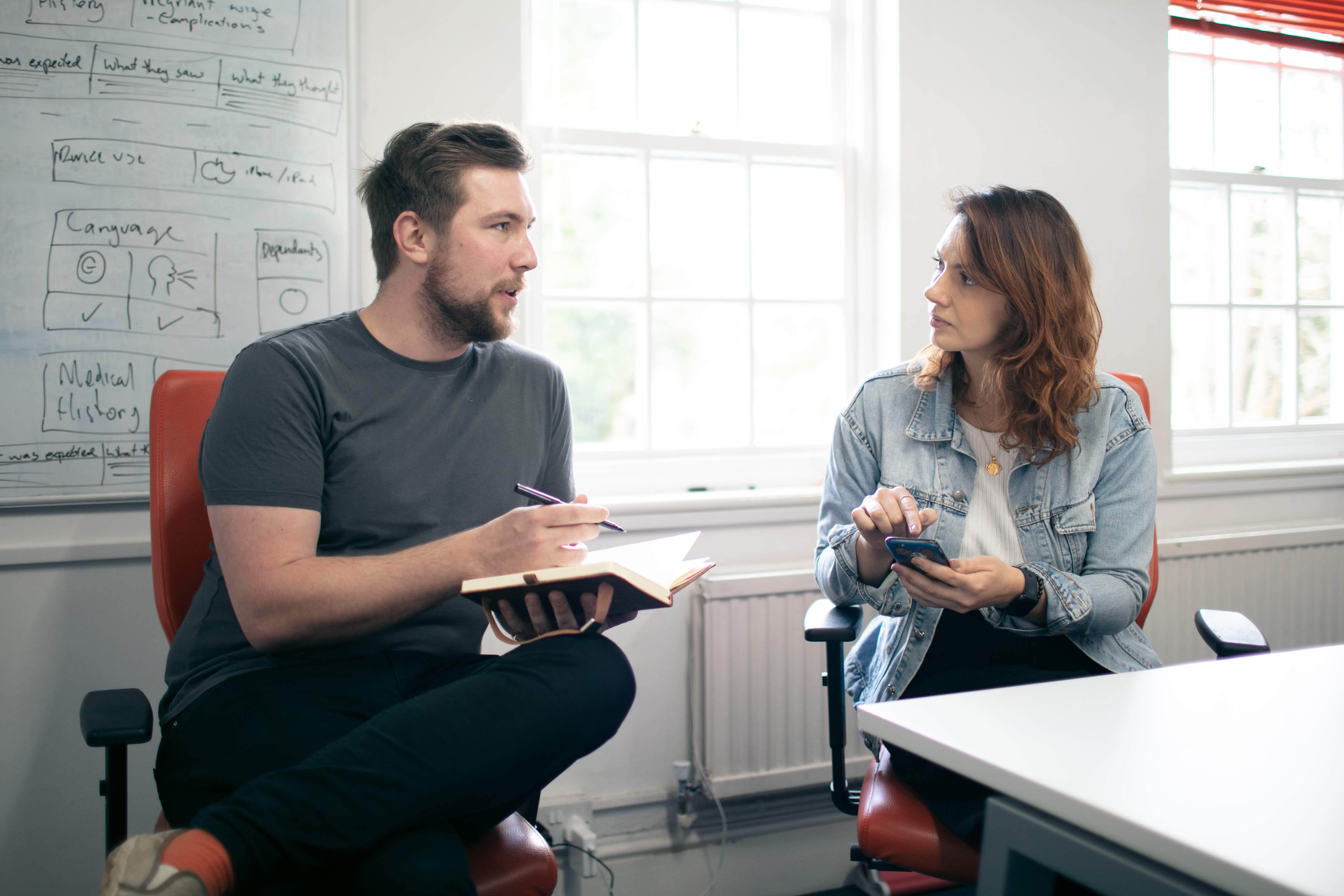 Photo of James and Fabiola conducting usability testing at Cyber-Duck's office